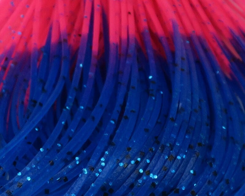 Hareline Crazy Legs: blue synthetic rubber strands with hot-pink tips, black specks and blue glitter for fly tying