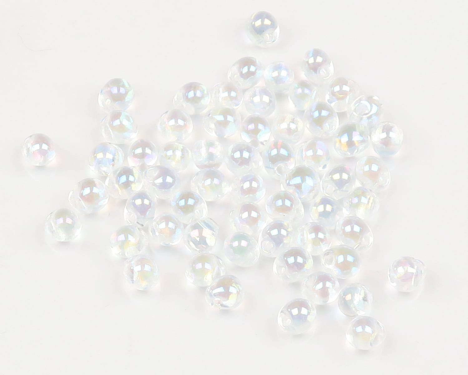 Clear iridescent hump-back glass beads for fly tying, small round Hareline beads with pearly rainbow sheen