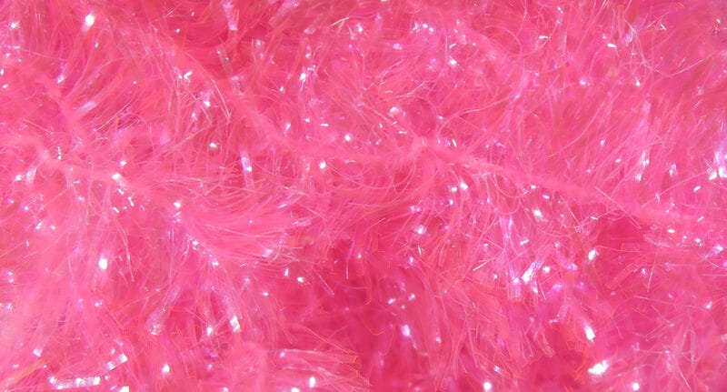 Bright pink Hareline Ice Chenille with fluffy synthetic fibers and iridescent tinsel flash for fly tying