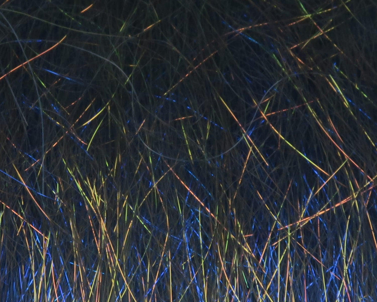 Dark iridescent Hareline Ice Dub minnow back fringe with blue, green and gold shimmering synthetic fibers for fly tying
