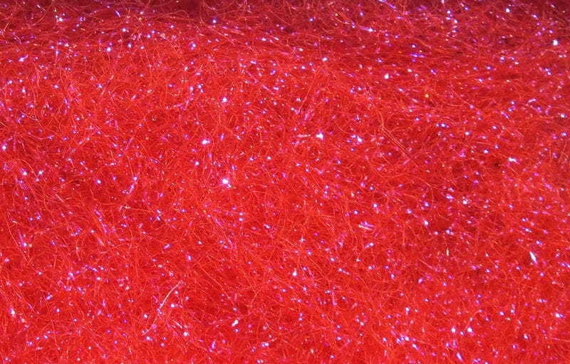Hareline Ice Dubbing bright red synthetic fly-tying fiber with fine hairy strands and iridescent sparkle