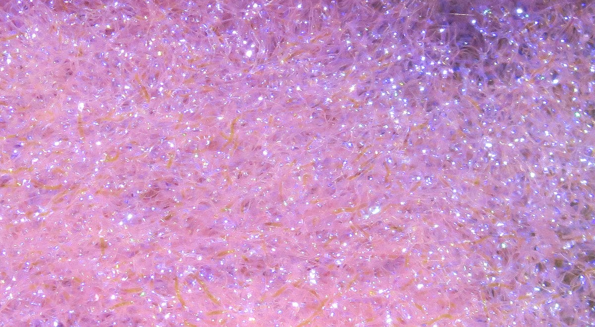 Hareline pink iridescent ice dubbing fibers with fine glitter sparkle for fly tying