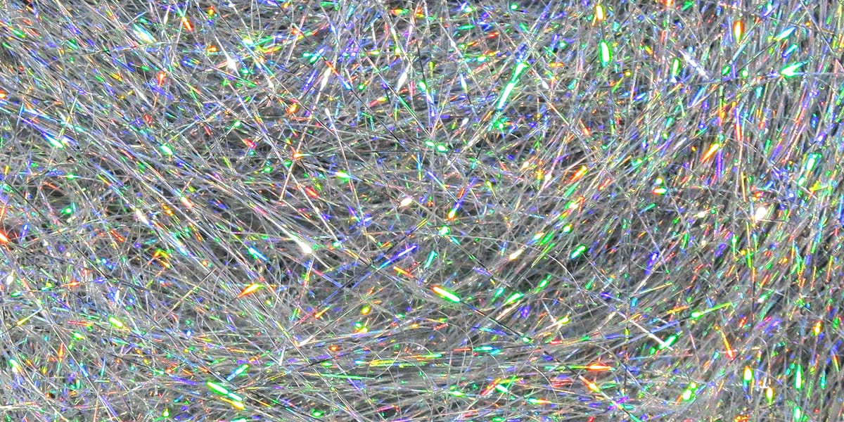 Silver holographic synthetic fibers, Hareline Ice Dubbing, fine iridescent tinsel strands for fly tying
