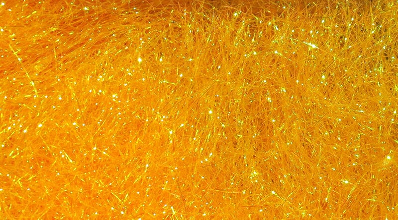 Bright golden-yellow Hareline Ice Dubbing synthetic fibers with iridescent sparkle, fine fly tying dubbing for fly bodies