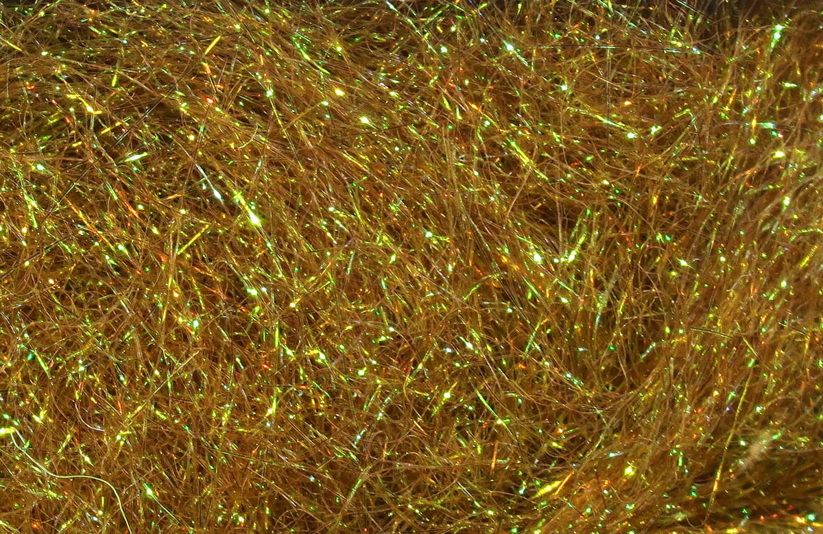 Golden brown Hareline Ice Dubbing with iridescent green and gold flash, fine synthetic fibers for fly tying