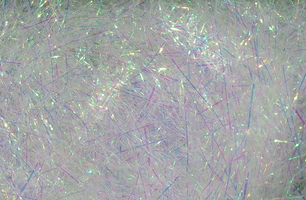 Hareline ice dubbing pearlescent white synthetic fibers with iridescent thin strands and sparkling flash for fly tying