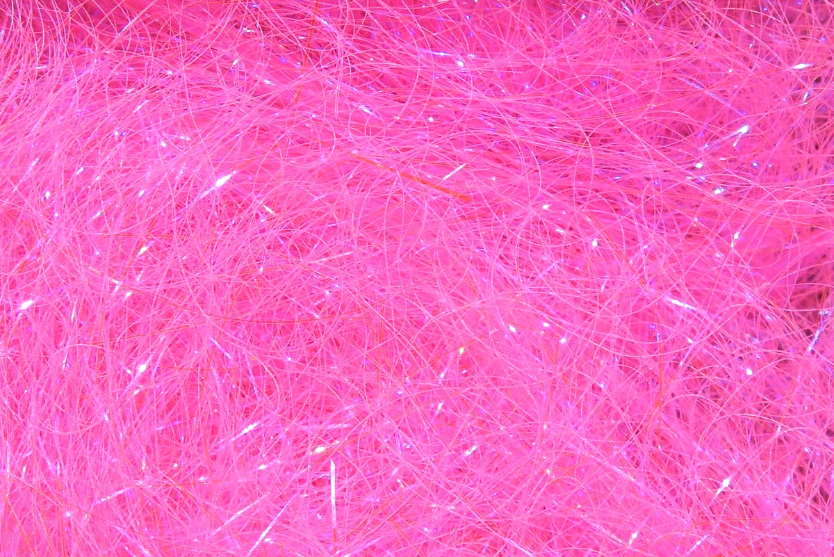 Hot pink Hareline Ice Dubbing: fine synthetic fibers with iridescent sparkle, fluffy fly tying dubbing material
