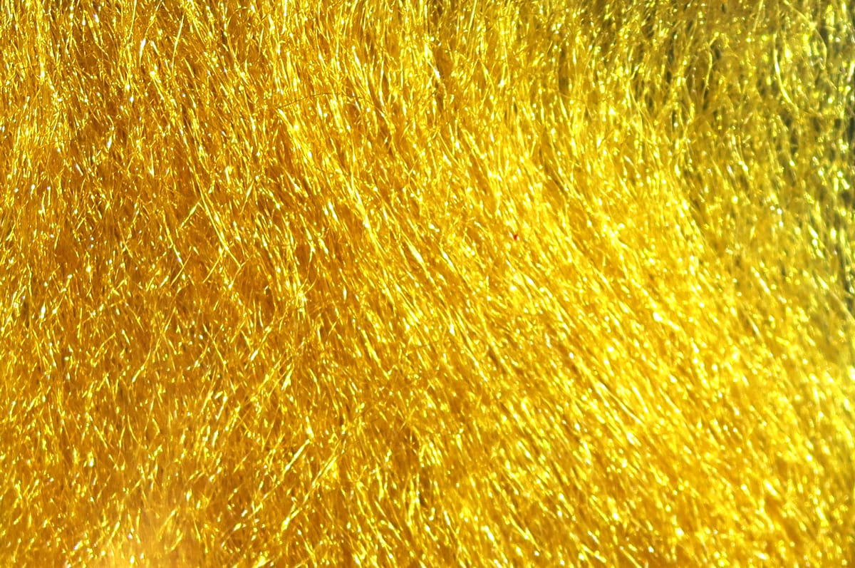 Golden yellow Hareline Ice Fur synthetic sparkle fur with fine iridescent fibers for fly tying and lure bodies