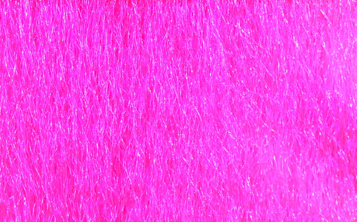 Bright hot pink Hareline Ice Fur with fine shimmering synthetic fibers for fly tying, glossy iridescent texture