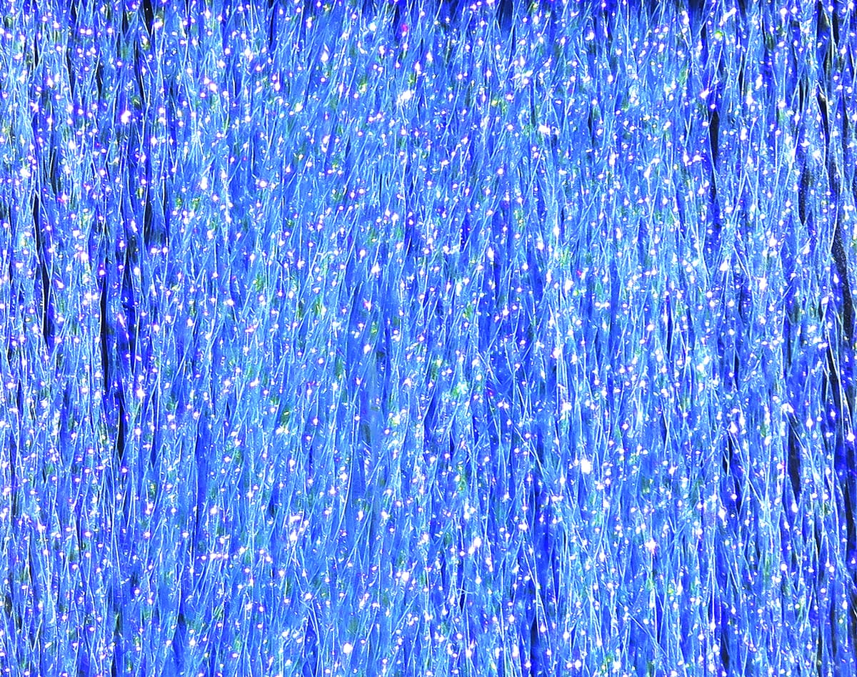 Sapphire blue Hareline Krystal Flash strands with iridescent glittery synthetic tinsel for fly tying