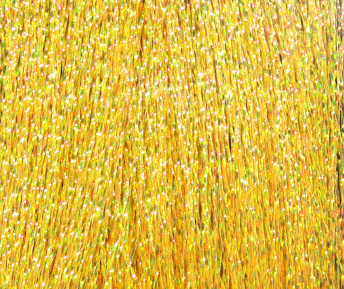 Gold Hareline Krystal Flash strands, iridescent synthetic fly tying fibers with green and pink sparkles