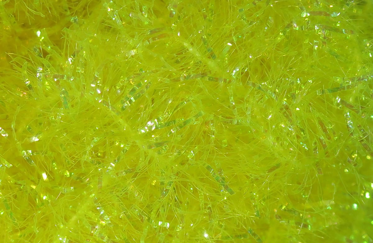 Chartreuse Hareline Krystal Flash chenille with fluffy fibrous strands and iridescent flash ribbons for fly tying