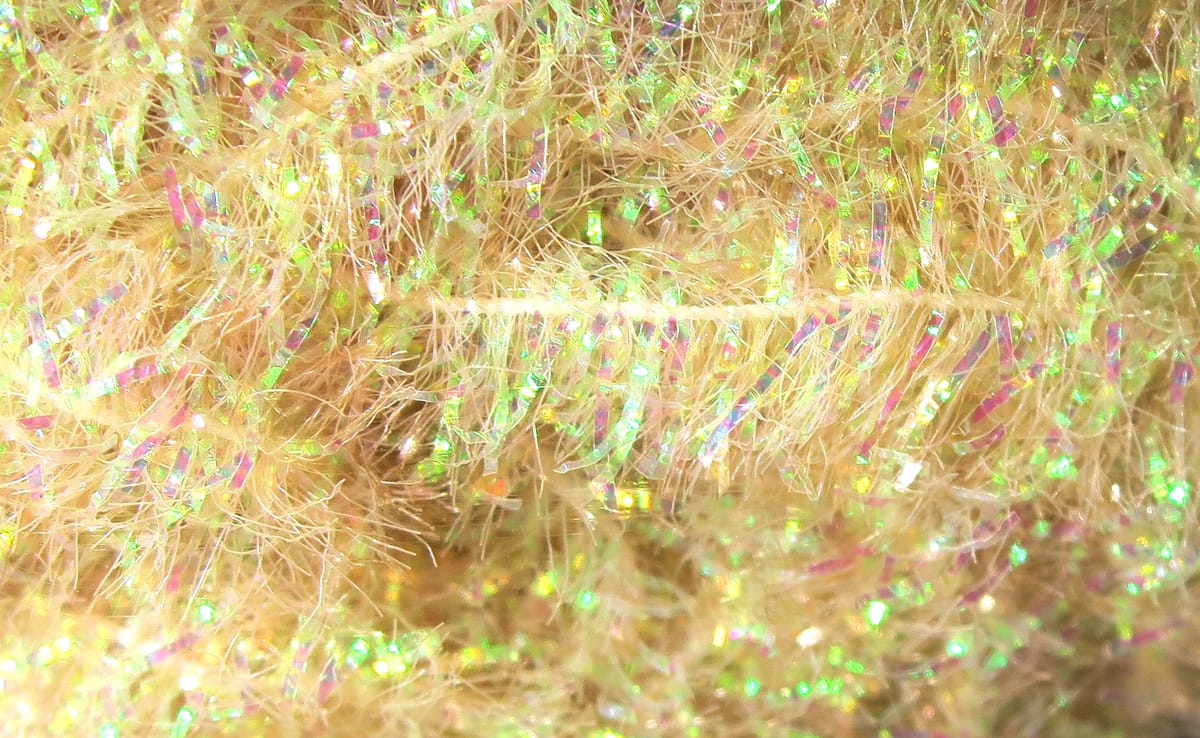 Pale gold Hareline Krystal Flash chenille with iridescent green and pink flash fibers, fuzzy metallic fly tying material