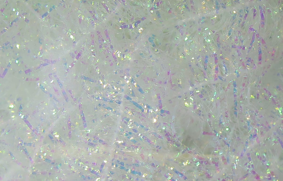 Iridescent white Krystal Flash chenille with holographic pink, blue and green tinsel-like strands