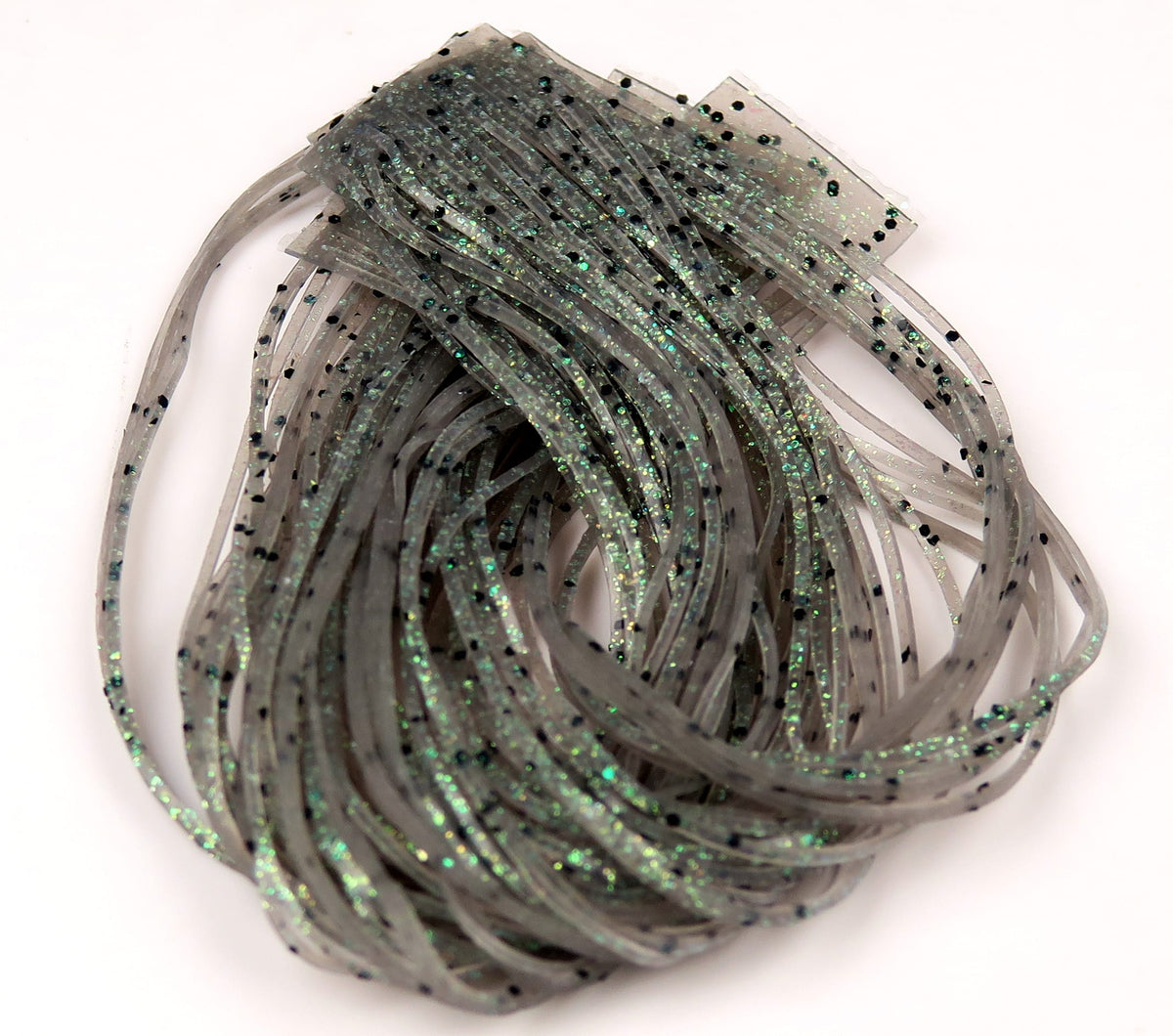 Gray translucent silicone Loco Legs skirt with green iridescent flakes and black specks for fly tying