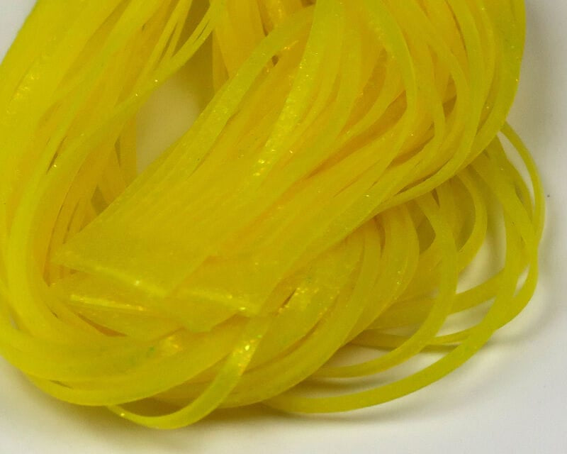 Bright yellow translucent flat rubber strands with subtle iridescent flakes, Hareline Magnum predator legs for fly tying