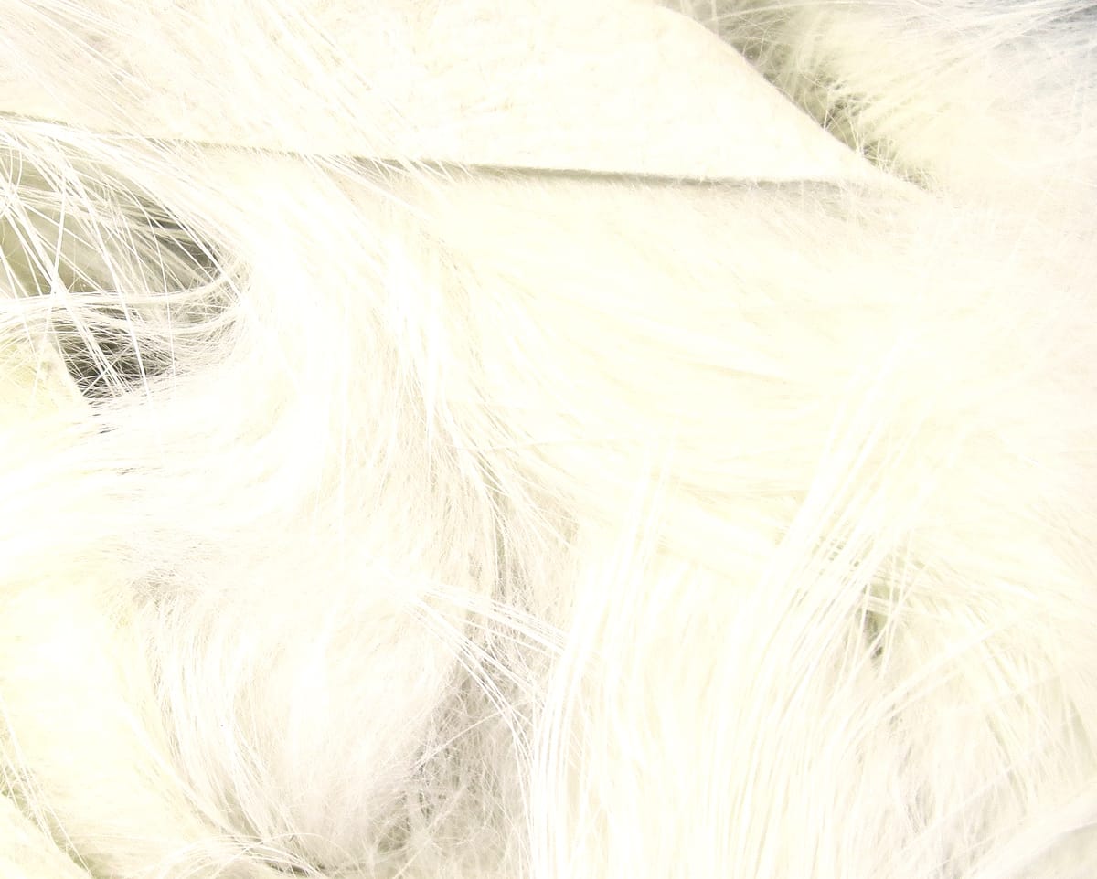 White Hareline Magnum rabbit fur strips with long fine soft fibers for fly tying