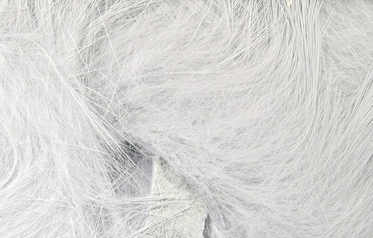 Soft silver-white rabbit fur strips with long silky guard hairs and fluffy underfur for fly tying