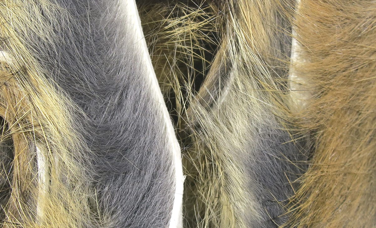 Hareline magnum rabbit fur strips in olive, tan and gray with long soft fibers for fly tying