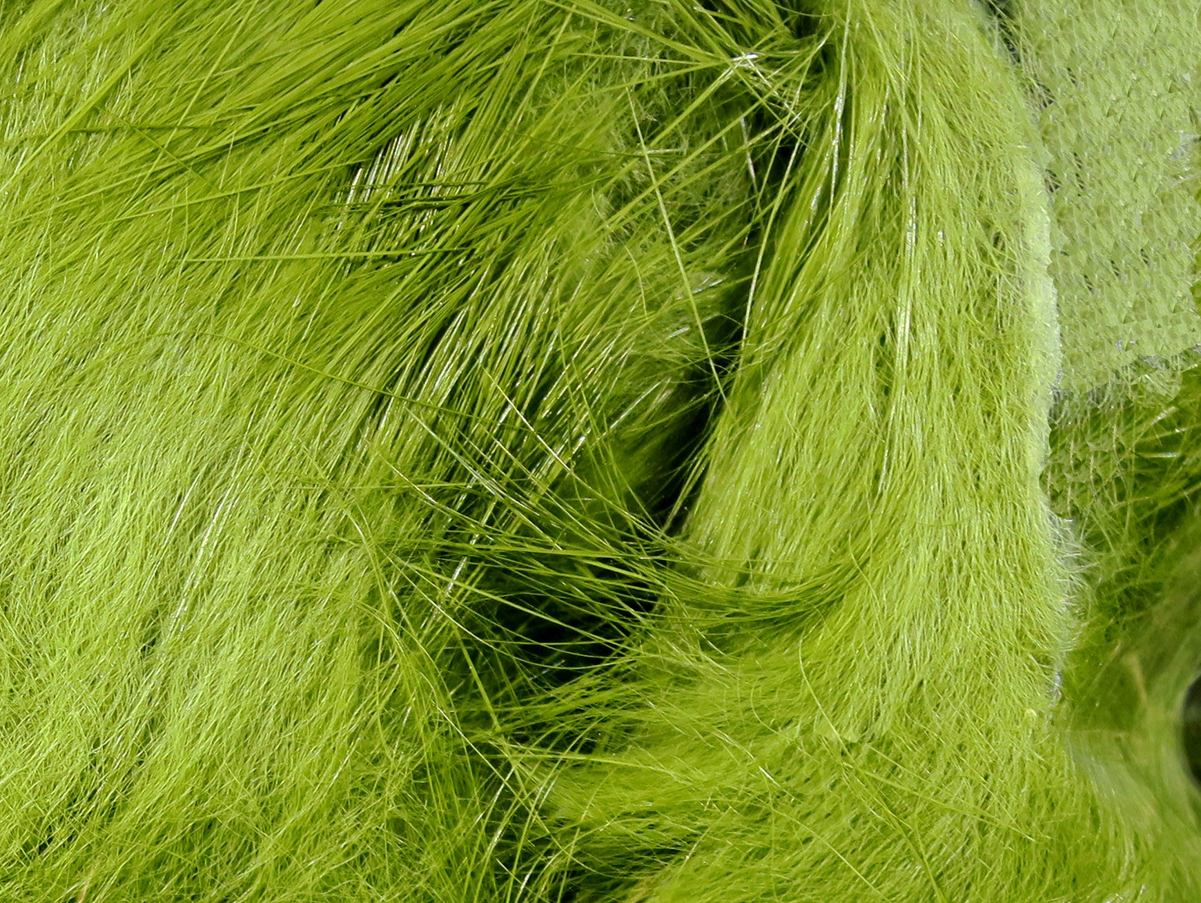 Chartreuse Hareline Magnum rabbit fur strips with long glossy guard hairs and soft underfur for fly tying