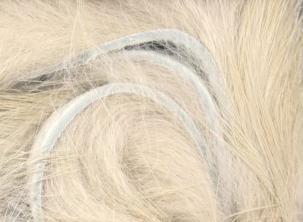 Pale cream Hareline Magnum rabbit fur strips with soft long hairs and light leather backing for fly tying