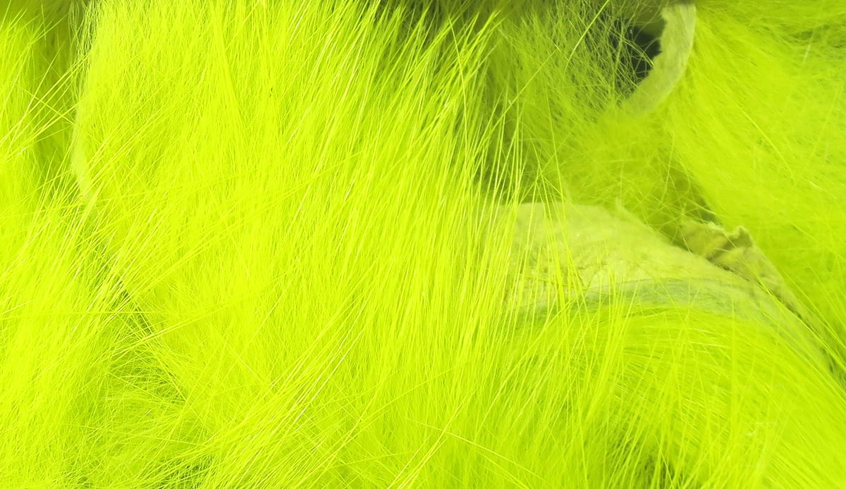 Hareline Magnum rabbit fur strips in bright chartreuse with long soft hair fibers for fly tying