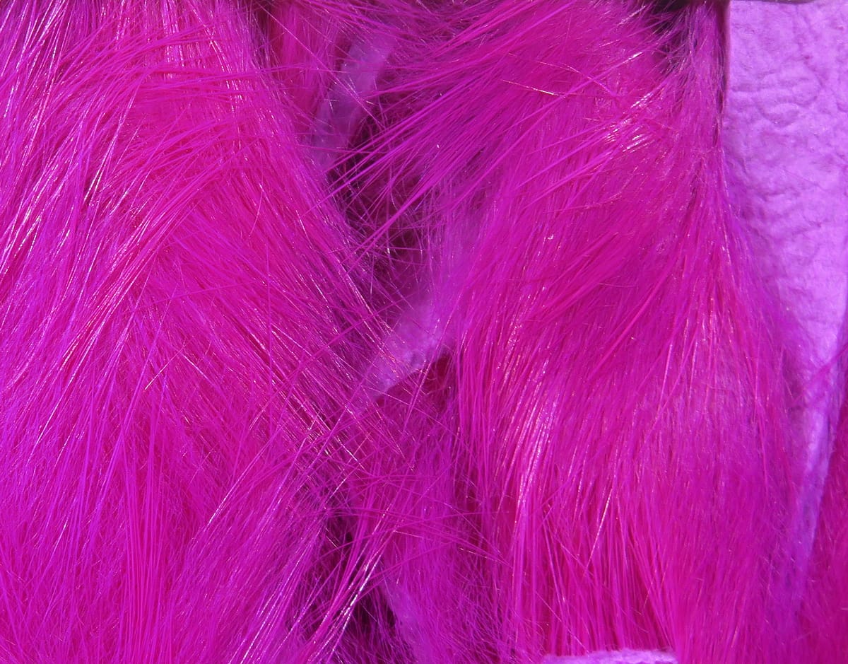 Magenta Hareline Magnum rabbit fur strips with long glossy fibers for fly tying