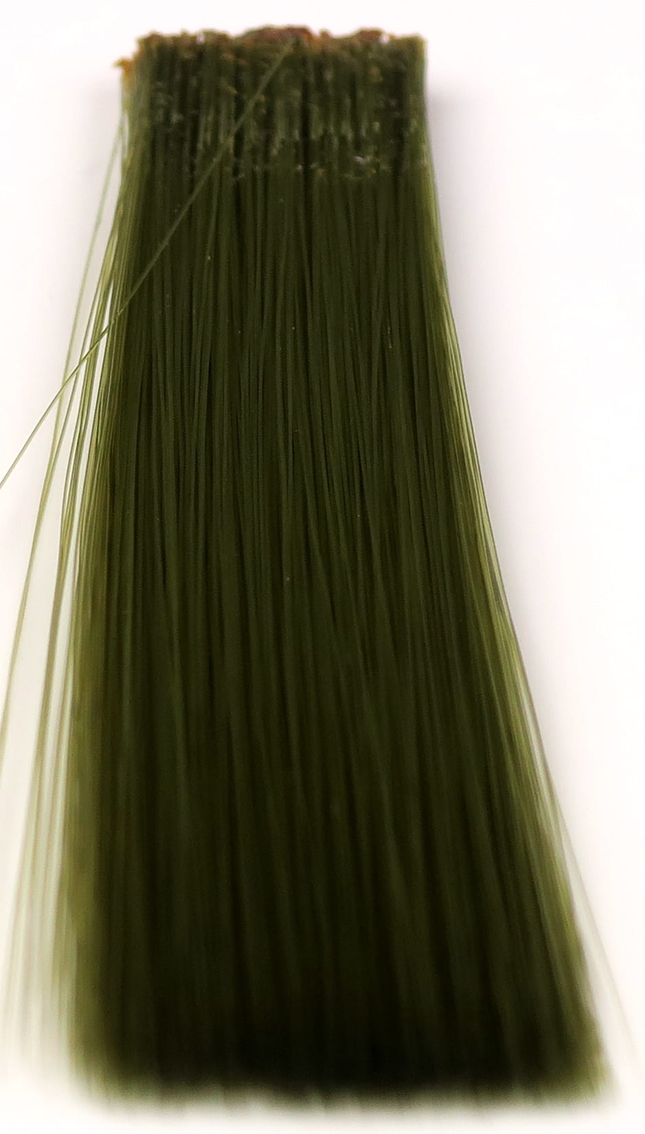 Olive green synthetic mayfly tails, long glossy bundled fibers flat-tied at base for fly tying