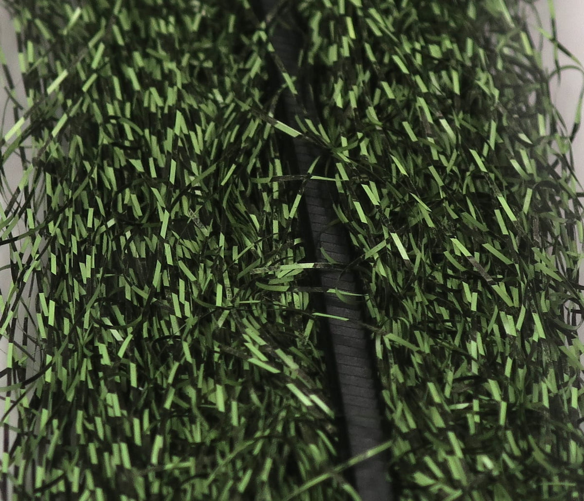Olive green and black micro barred synthetic fibers, densely packed shiny strands for fly tying