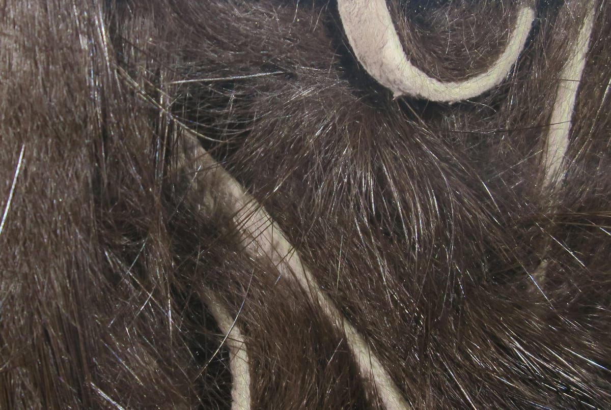Dark brown Hareline micro rabbit fur strips with pale leather backing, fine soft fur and glossy guard hairs for fly tying