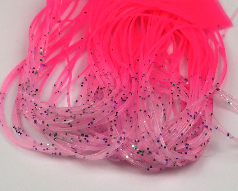 Neon pink Hareline micro silicone legs for fly tying, thin translucent strands with black and holographic glitter flecks