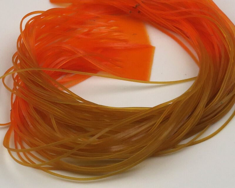Hareline micro silicone legs in orange and olive brown, thin translucent silicone strands for fly tying