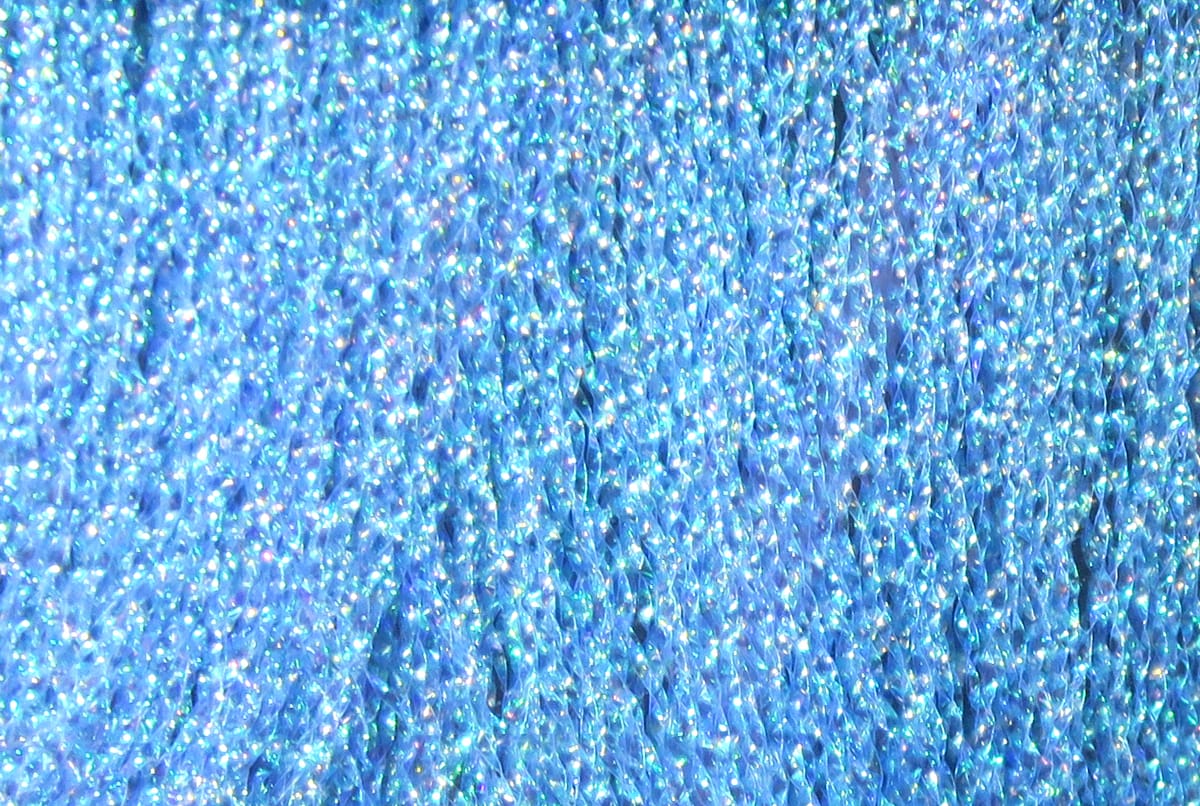 Iridescent blue Hareline Midge Flash synthetic fibers, fine holographic strands with sparkling shimmer for fly tying