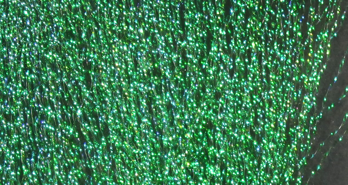 Hareline Midge Flash green synthetic flash fibers with holographic sparkle, thin shimmering strands for fly tying