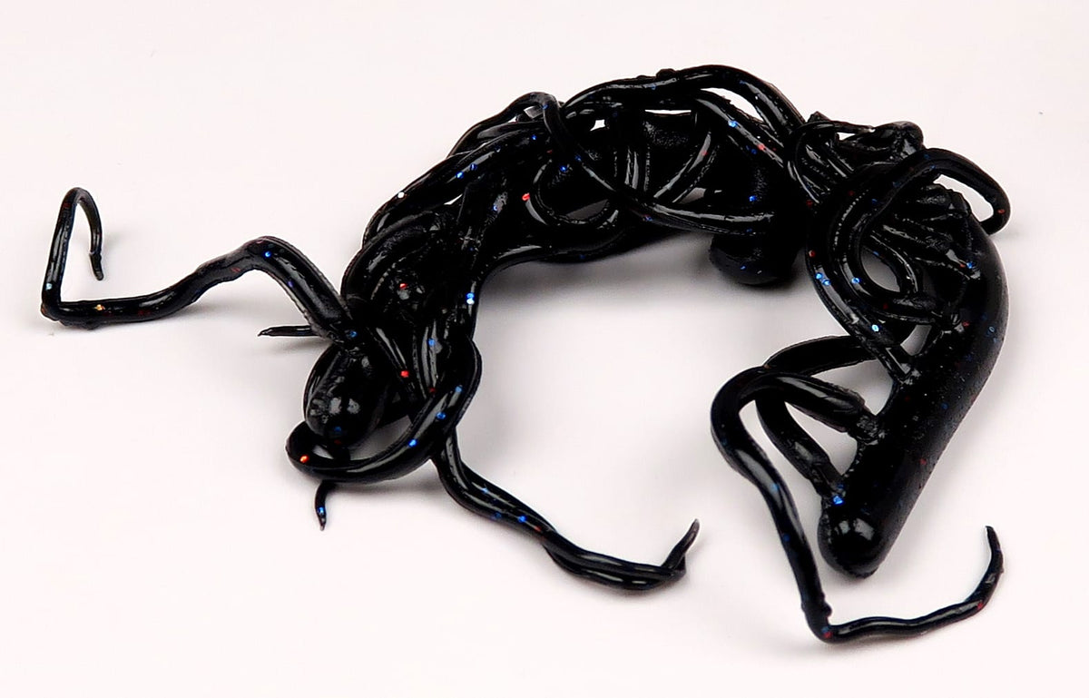 Black Hareline Mini Squiggle worm, glossy soft-plastic fly tying lure with blue and red glitter flecks and tangled tentacles