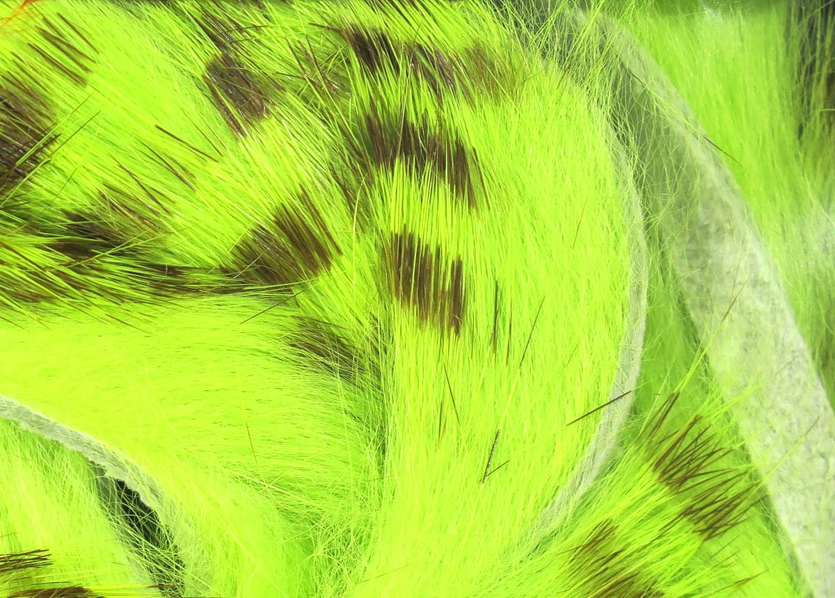 Hareline olive-barred rabbit fur strips, bright chartreuse-olive fur with dark brown bars and long guard hairs for fly tying