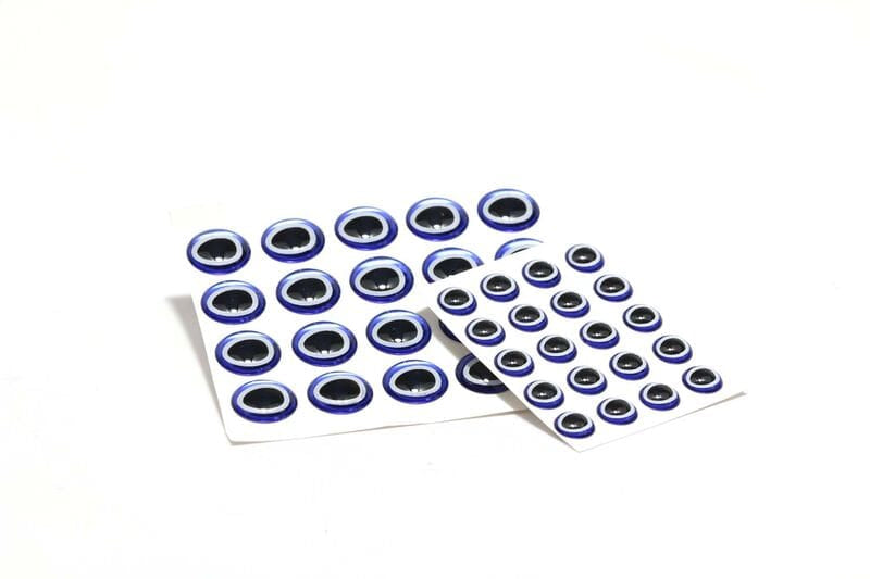 Sheets of 3D adhesive eyes, glossy domed plastic with black oval pupils and blue-white rings for fly tying