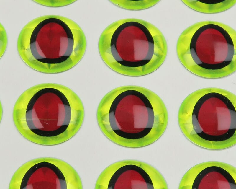 Hareline 3D adhesive eyes for fly tying, neon chartreuse domes with black-ringed red oval pupils on adhesive sheet