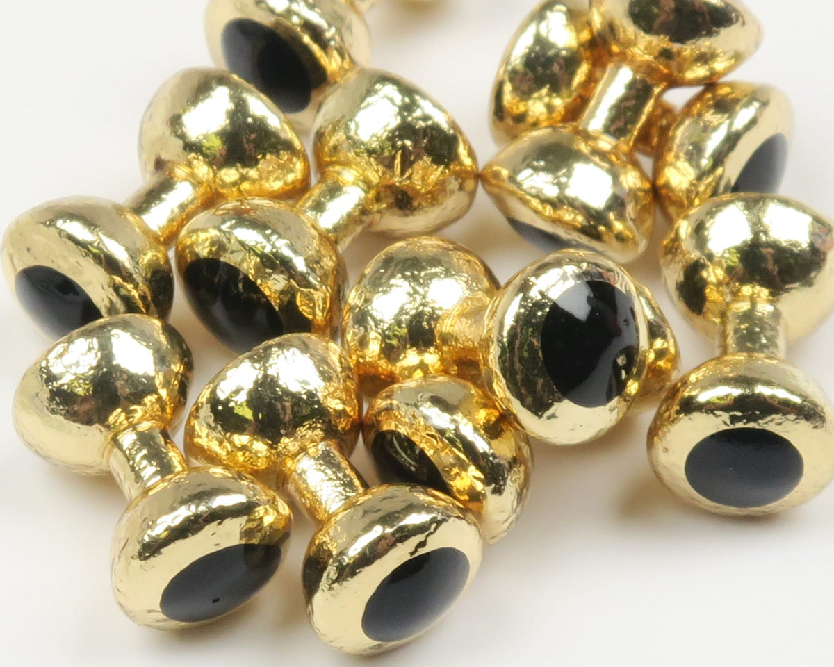 Gold painted lead eyes with glossy black pupils, textured metallic finish, dumbbell-style fly tying eyes