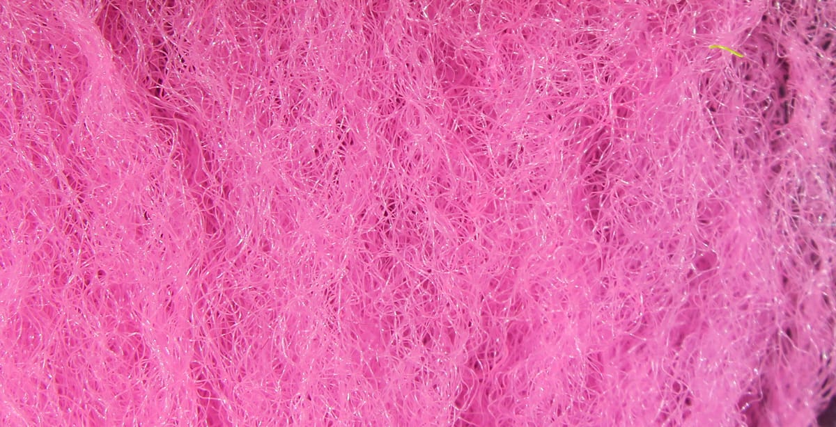 Bright pink synthetic fibrous Para Post Wing material with fine tangled strands and subtle sparkle for fly tying