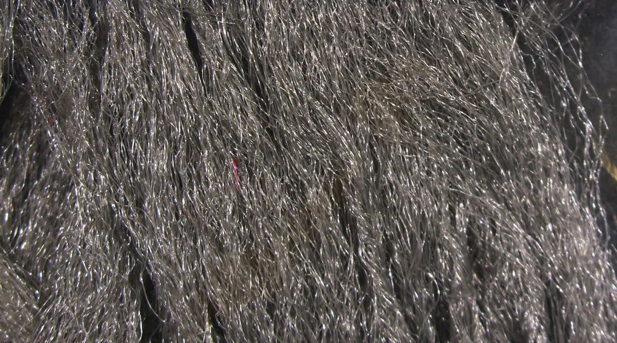 Hareline Para Post Wing synthetic fly tying fibers, long silver-gray glossy strands with metallic shimmer