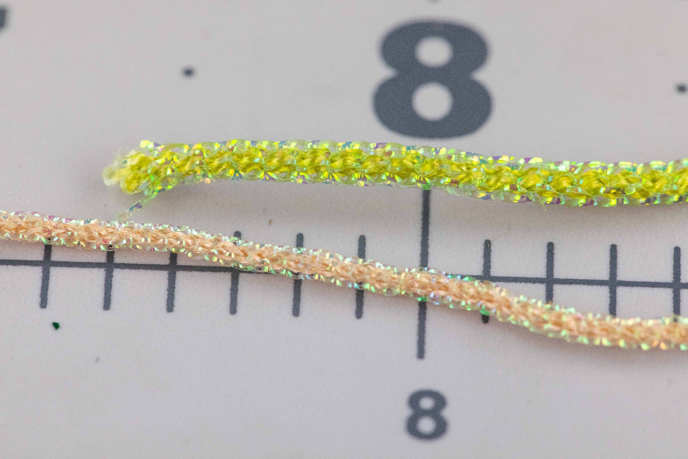 Iridescent chartreuse pearl core braid with yellow braided core and holographic fibers for fly tying