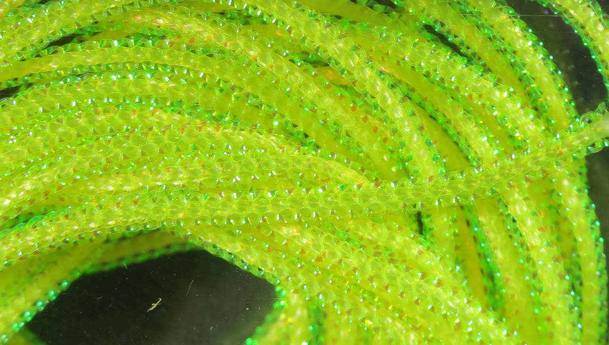 Hareline pearl core braid in chartreuse yellow-green, iridescent braided tubing with sparkly reflective core for fly tying