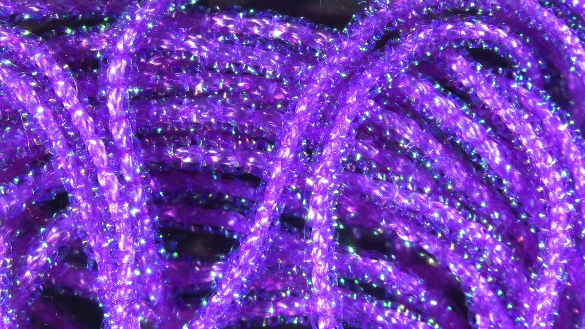 Hareline purple pearl core braid, sparkly iridescent synthetic braided strands with pearlized core