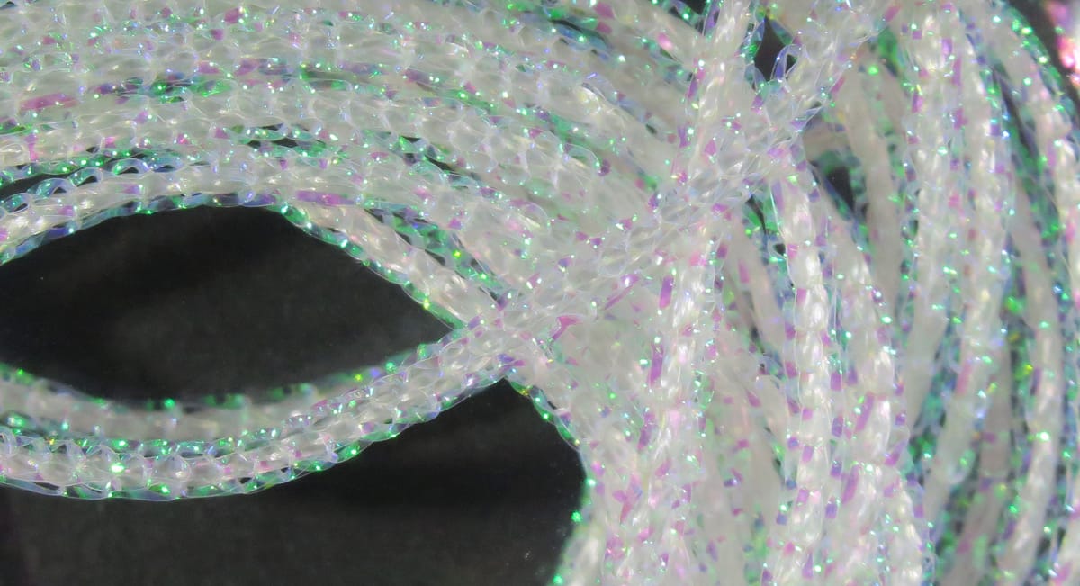 Translucent pearl core braid strands with green and purple holographic flashes, pearlescent fly tying material