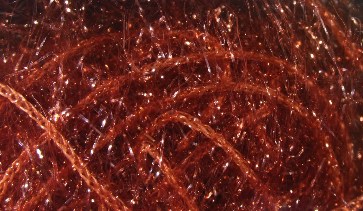 Copper red Hareline Polar Chenille fly tying material with sparkly metallic fibers and fuzzy braided core