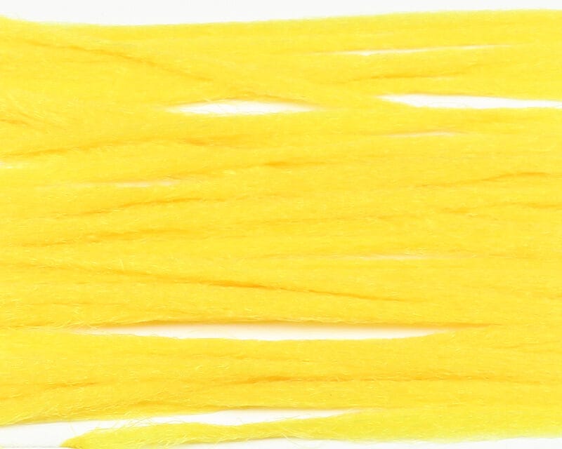 Bright yellow Hareline polypropylene floating yarn strands with fibrous synthetic texture for fly tying