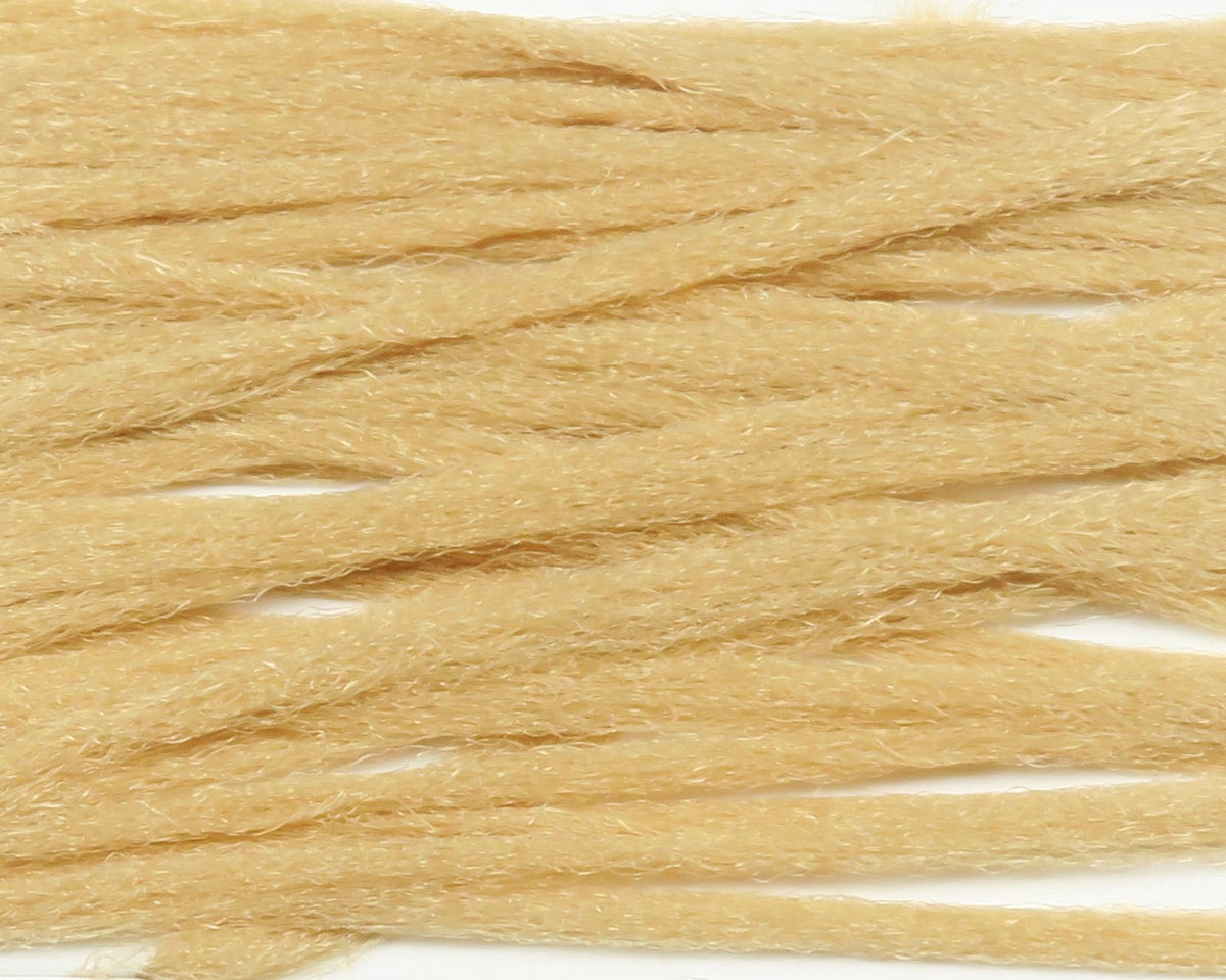 Beige tan fuzzy polypropylene floating yarn strands with hairy texture for fly tying