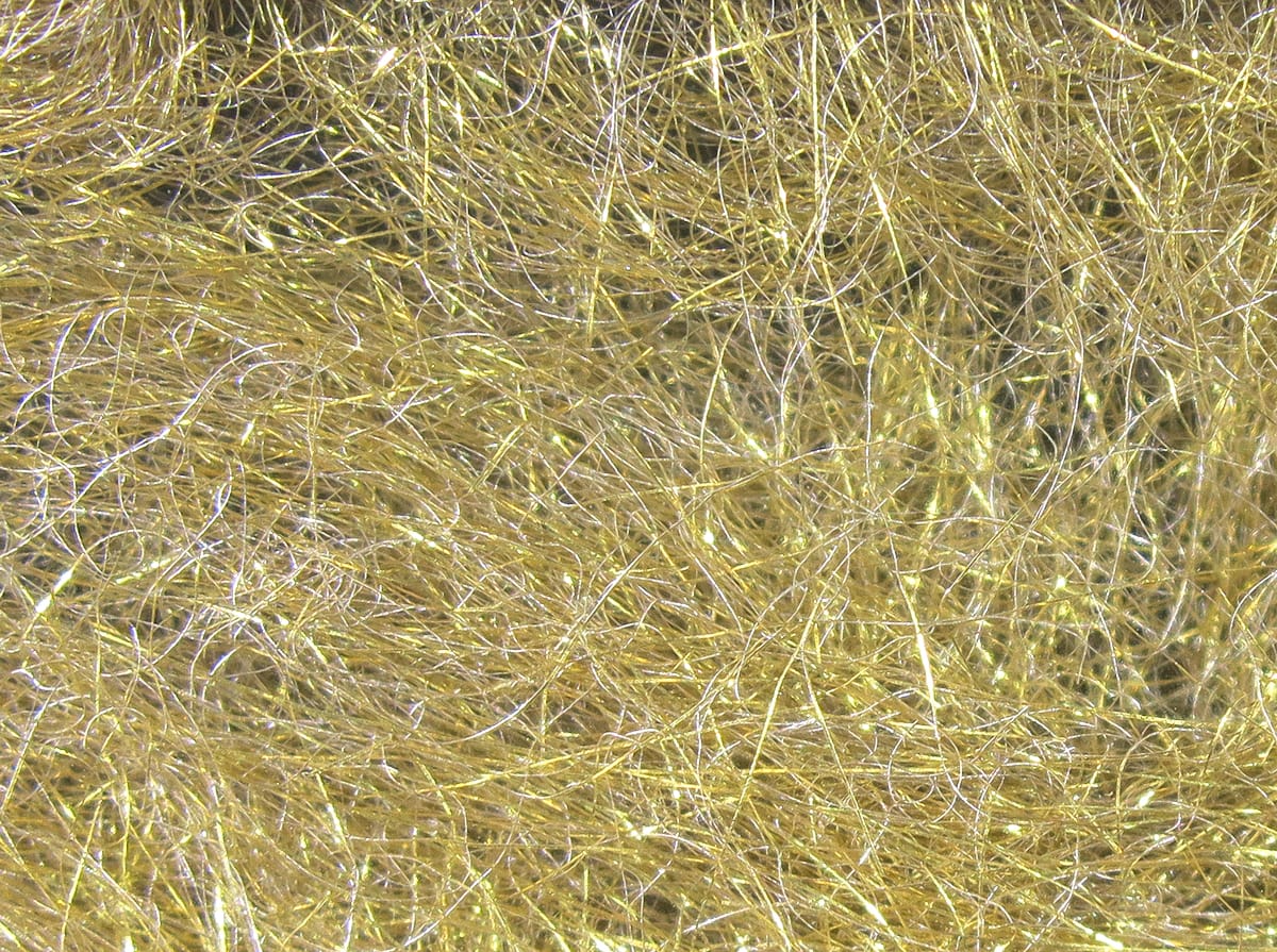 Hareline Quick Descent dubbing: tangled fine golden synthetic fibers with subtle iridescent flash for fly tying
