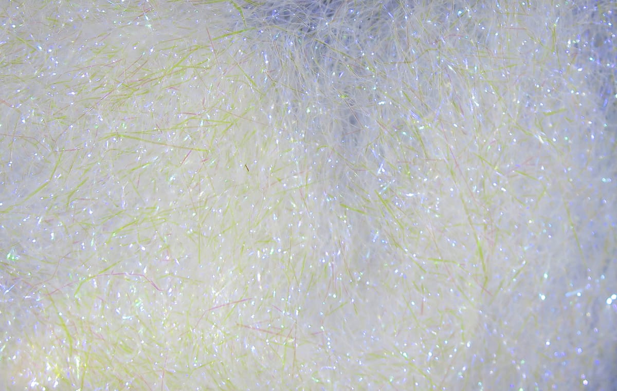 Hareline Ripple Ice Dub white iridescent synthetic dubbing with pale chartreuse fibers for fly tying